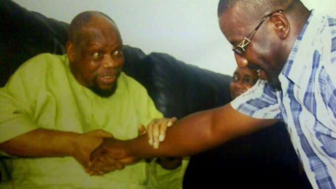 Ikemba of Nnewi, Chief Odumegwu Ojukwu in a warm handshake with his in-law Dr. Josef Onoh